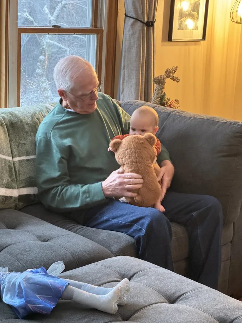 Robert holding a puppy