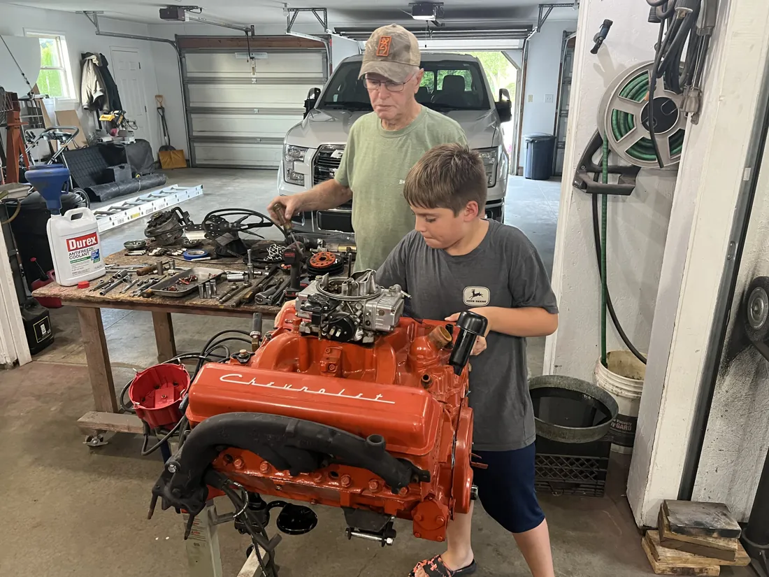Robert restoring an engine in the garage
