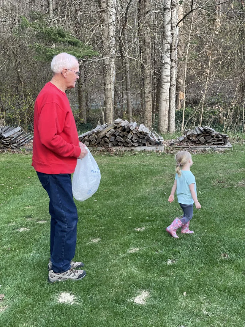 Robert out in the yard with a grandchild