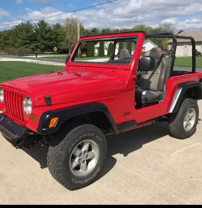 A restored red Jeep