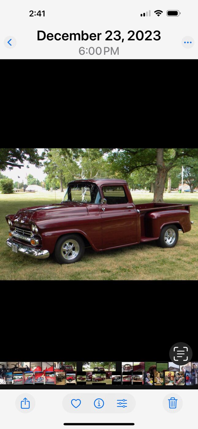 A restored maroon classic pickup