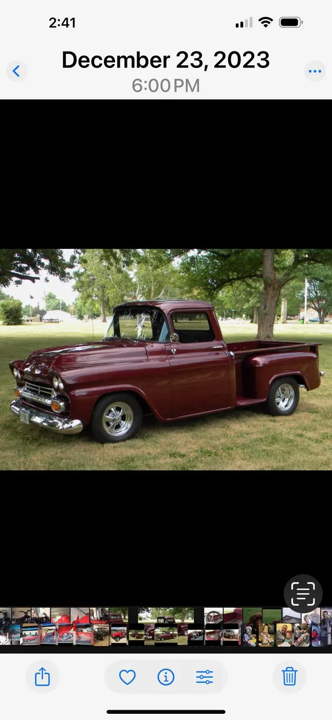 A restored maroon classic pickup
