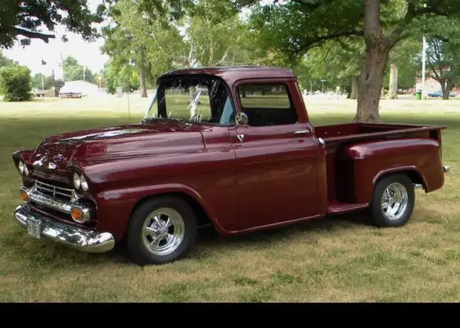 A restored maroon classic pickup